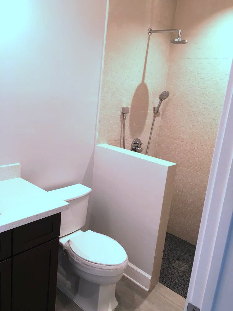 Walk-in shower and toilet installed by Robert's Plumbing Service