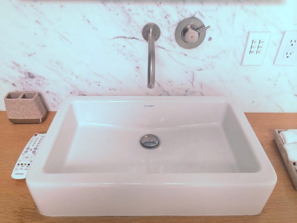 Wall-mount faucet and vessel sink installed by Robert's Plumbing Service